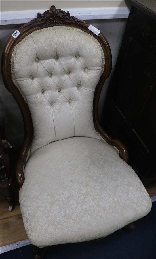 A Victorian walnut nursing chair